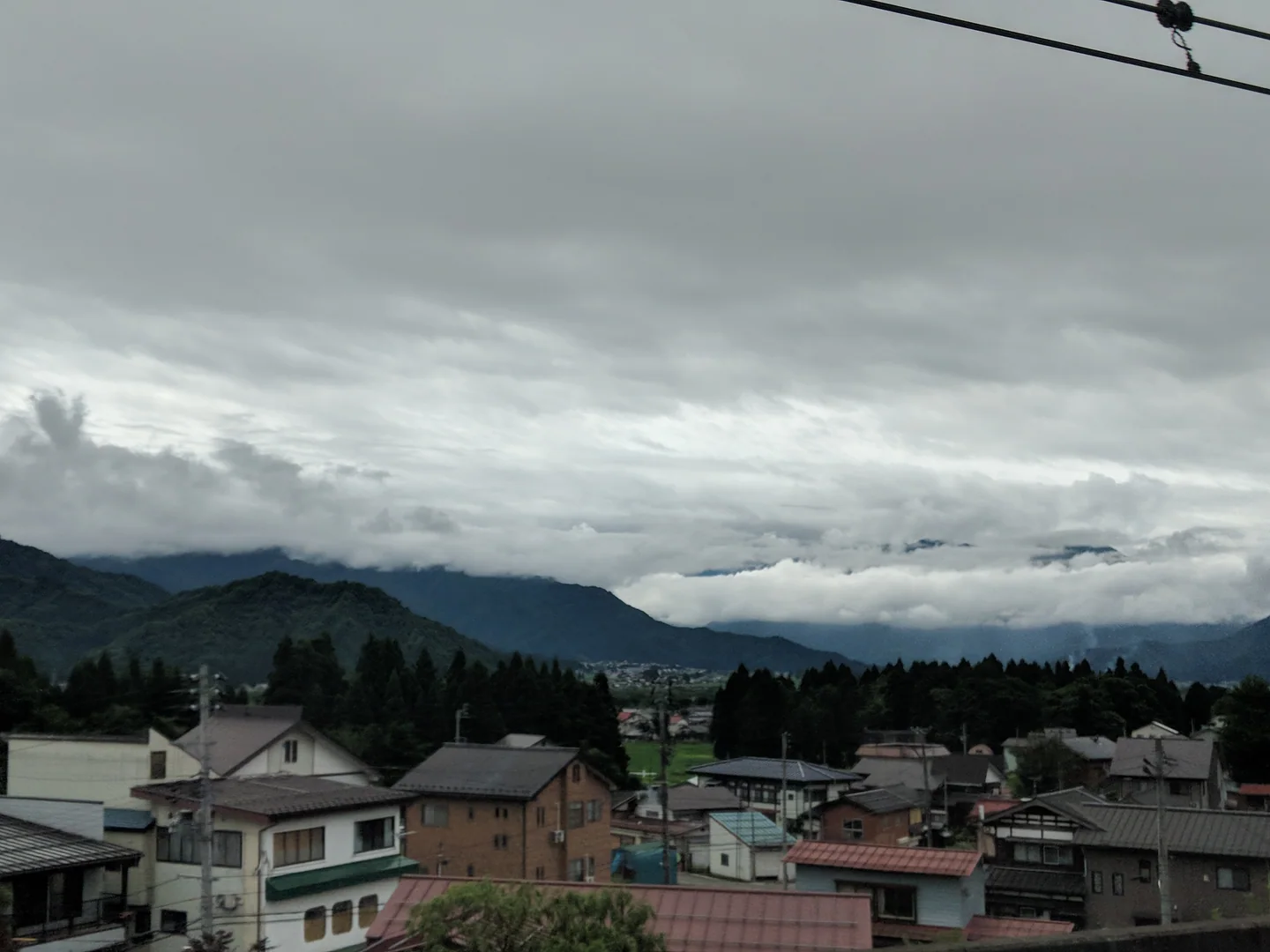 A cloudy view across the buildings and mountains of Nagaoka during Harry's first week in Japan.